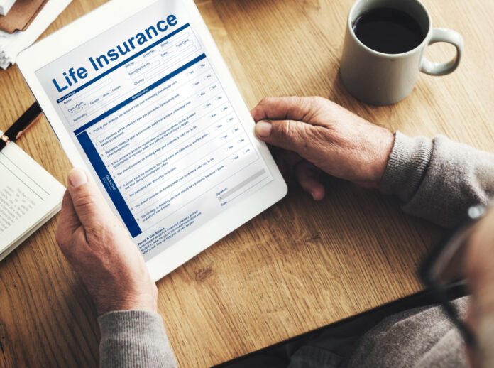 Person holding a life insurance contract.