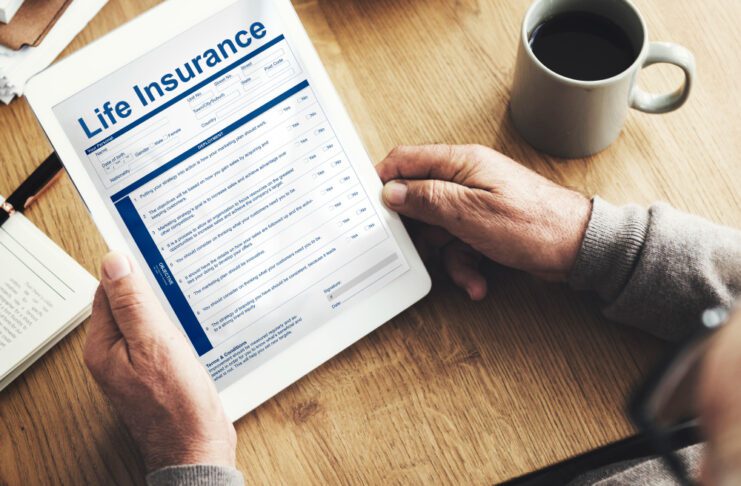 Person holding a life insurance contract.