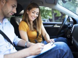 Woman signing a car insurance policy contract